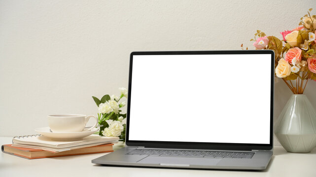 Close-up, a women's office desk with modern laptop computer