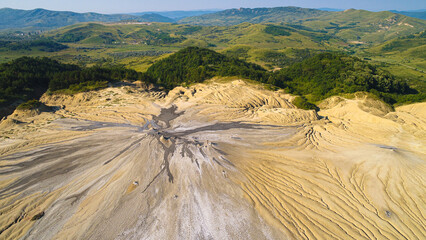 Aerial spectacular view over Muddy Volcanos in Romania at Paclele Mici during a summer morning