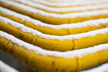 Snow on factory pipes in winter