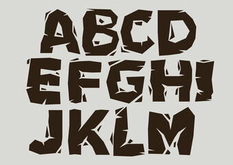 Stylized broken font and alphabet of A to M.