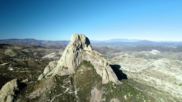 aerial shot of pena de bernal at sunset