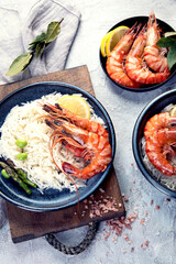 Shrimps with rice on light gray background.