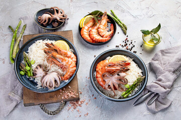 Shrimps with rice on light gray background.