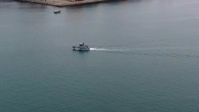 Peruvian Coastguard Patrol Vessel Navigating Across The Callao Harbor In Lima, Peru. aerial