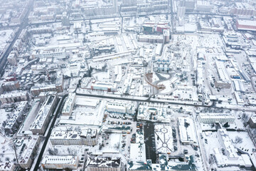 urban industrial area, covered by snow on a foggy winter day. birds eyes view.
