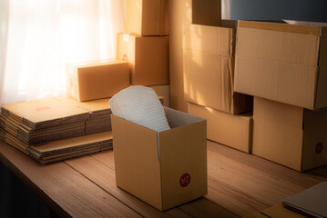 Packing products for delivery, shipping service. Delivery concept for private companies delivery with care, Craft present box. Online shopping. Packed household stuff for moving into new house.