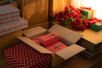 Packing valentine's day products for delivery, shipping service. Delivery concept for private companies delivery with care, Craft present box. Online shopping. love present and romantic gifts.