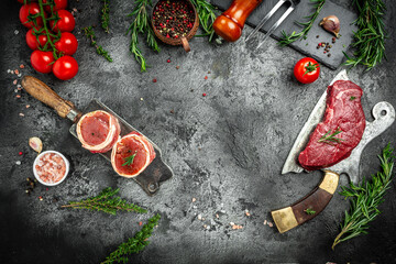 Variety of raw black angus prime meat steaks beef rump steak, Tenderloin fillet mignon for grilling on old meat cleaver on dark background. banner, menu recipe top view