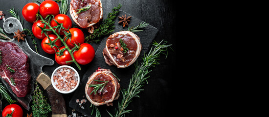 Variety of raw beef meat steaks for grilling with seasoning on over meat butcher knife. banner, menu recipe top view