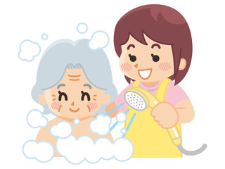 高齢女性に入浴介助を行う介護士　ヘルパー