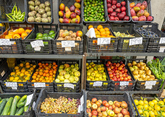 Fruits and vegetables for sale at a sales stand on the street