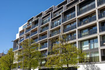 Modern apartment building with floor-to-ceiling windows in Berlin, Germany