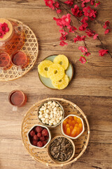 Bowls with nuts, seeds and candied fruits to eat with tea on Chinese New Yeer