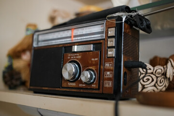 Retro radio stands on a shelf