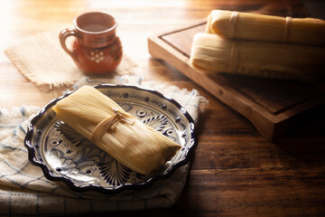 Tamales. Prehispanic dish typical of Mexico and some Latin American countries. Corn dough wrapped in corn leaves. The tamales are steamed.