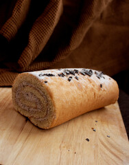 biscuit roll on brown background