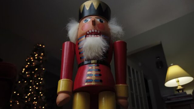Medium close shot tilting up on a German nutcracker soldier