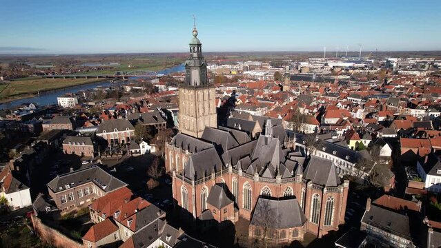 Aerial view of Dutch medieval city. Walburgiskerk church in picturesque tower town Zutphen in The Netherlands with details of the slanted rooftops of the religious building.