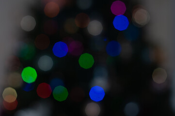 Christmas light background. Holiday glowing backdrop. Defocused Background With Blinking Stars. Blurred Bokeh.