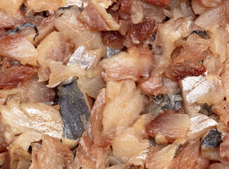 Sliced herring fillet as background.