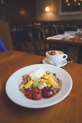 Granola with fruit, flat white
