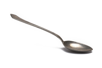 Closeup vintage silver dessert spoon white background