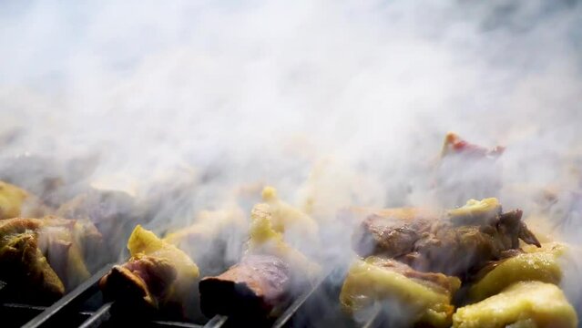 slow motion shot of Traditional bar b q of mutton at charsi tikka shop, Peshawar, Pakistan
