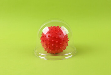 Virus molecule under transparent dome on green background. Protection, isolation concept. Minimal layout