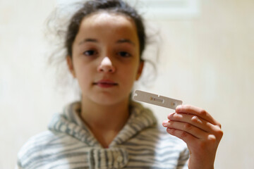 Girl with Coronavirus antigen test with negative result