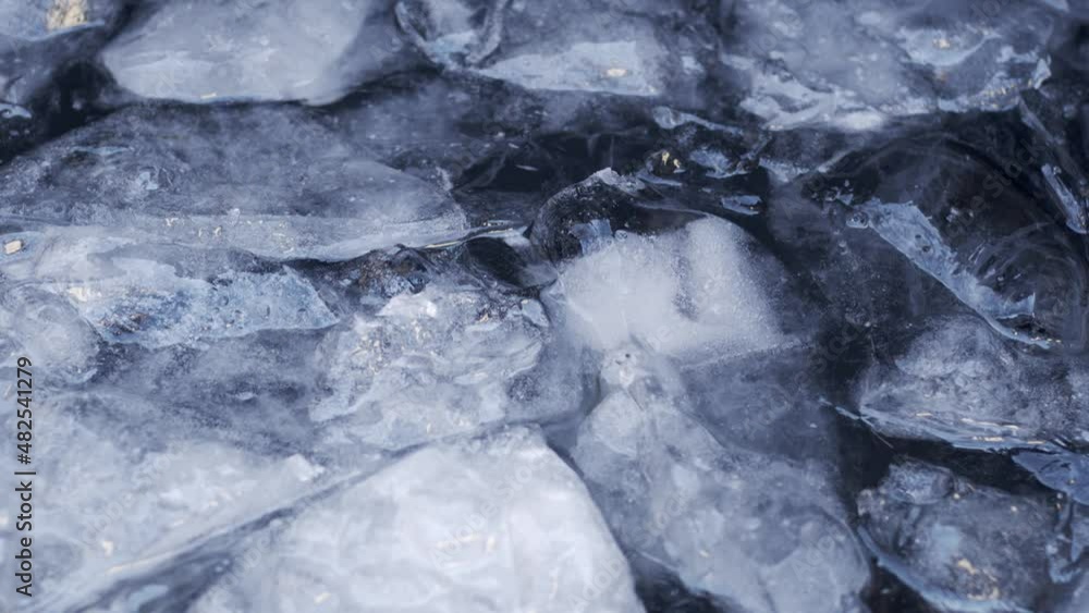 Poster cold ice water moving in a lake with ice chunks floating