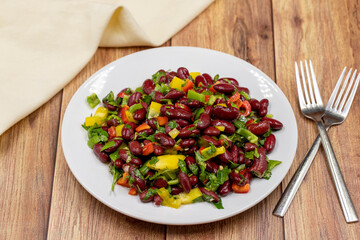 Mexican Bean Salad. Homemade black bean served in a ceramic plate, selective focus