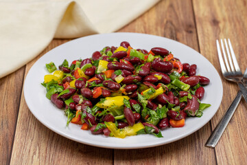 Mexican Bean Salad. Homemade black bean served in a ceramic plate, selective focus