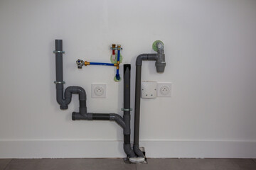 water inlet and drain pipe in a new house inside installation of plastic domestic water pipes in new apartment