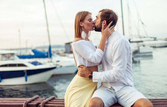 Kissing couple in love in the yacht club. Romantic, love concept
