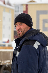 Close-up facial portrait of worker at construction site