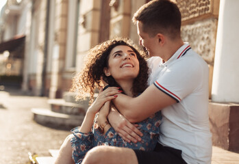 Young couple in love having fun, spending time together in the city. Relationship concept, young love