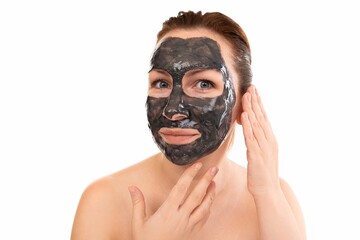 woman with black cosmetic mask on her face