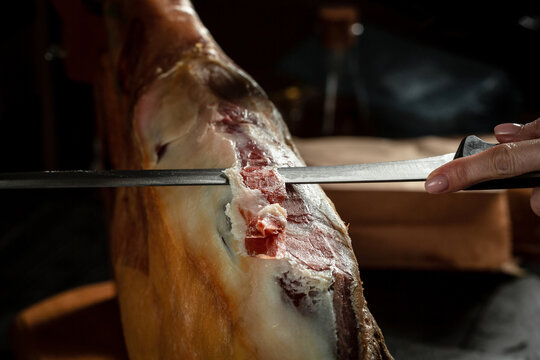 Iberian ham cutter. Traditional Spanish ham, Slicing of dry-cured. Hamon is forty-eight weeks old. gastronomic products of Spain