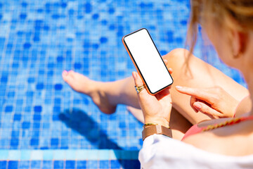 Woman using mobile phone by the pool, screen mockup