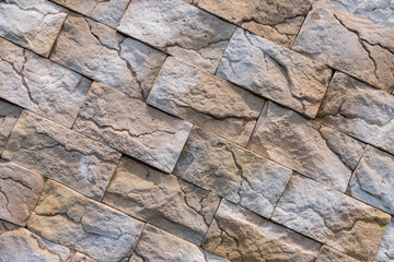 Decorative brown stone wall with a beautiful diagonal texture