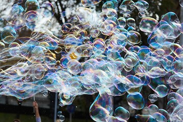 Bright soap bubbles on the city street. Close-up. The concept of a holiday