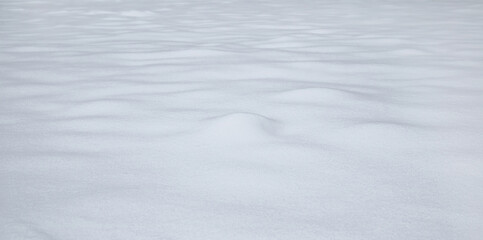 Natural winter background with snow drifts