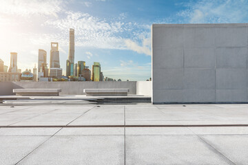 Panoramic skyline and modern commercial buildings with empty square floor in Shanghai, China.