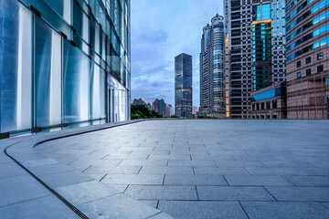 Fototapeta premium Empty square floor and city skyline with modern commercial buildings at night in Shanghai, China.