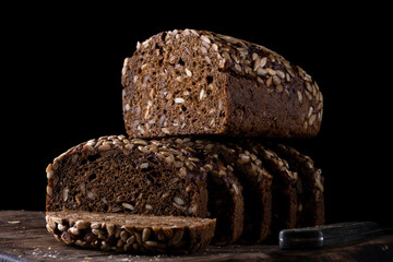 Rustic grain bread with sunflower seeds on a wooden board