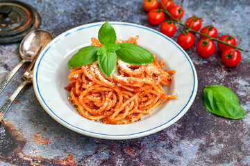Spaghetti  bolognese .Italian home made meal Fresh  bucatini pasta with tomato sauce, basil, herbs ,parmesan cheese ,fresh cherry tomatoes and parsley on wooden background. Kitchen Poster 