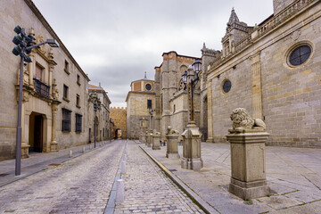Pedestrian street next to the medieval cathedral and ancient monuments in the city of Avila, Spain.