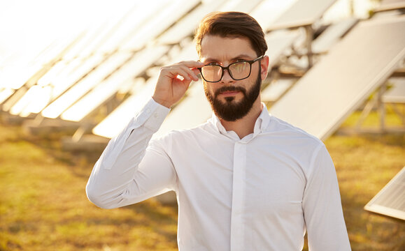 Manager In Field With Solar Panels