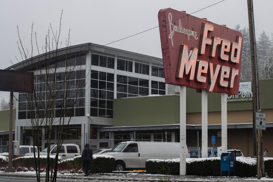 Portland, OR, USA - Dec 28, 2021: Exterior view of the Fred Meyer Burlingame store in southwest Portland, Oregon, during the winter after snowfall. Fred Meyer is a chain of hypermarket superstores.