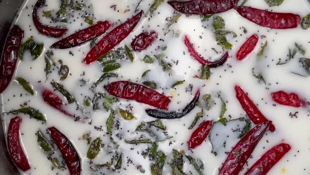 Masala Chaas - Red And Green Chili Pepper On Buttermilk. -high Angle